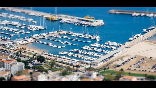 Video Reference: marina, dock, water transportation, port, aerial photography, water, bird's eye view, urban design, city, boat