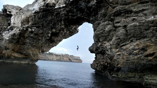 Video Reference: cave, geological formation, cliff, sea, rock, coast, landscape, ocean, water, coastline, beach, travel, mountain