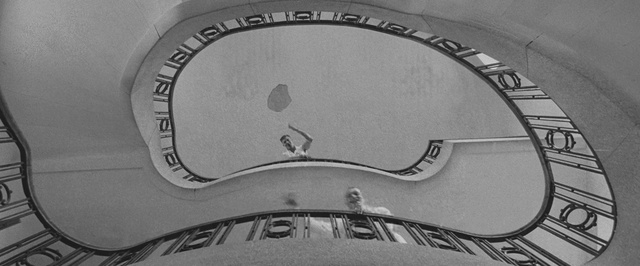 Video Reference: Black-and-white, Emblem, Font, Auto part, Automotive tire, Photography, Monochrome, Logo, Rim, Style, Photo, Black, Bicycle, Sitting, White, Clock, Large, Parked, Train, Table, Old, Cat, Game, Air, Ball, Meter, Text, Black and white
