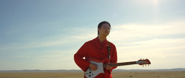 Video Reference: red, sky, cloud, vacation, sea, fun, beach, sand, surfing equipment and supplies, water, Person