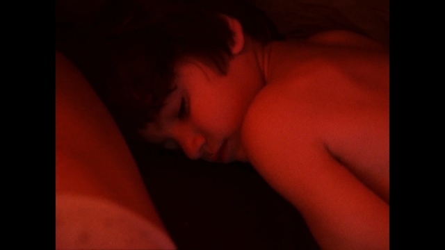 Video Reference: black, red, face, skin, nose, cheek, close up, mouth, darkness, emotion, Person