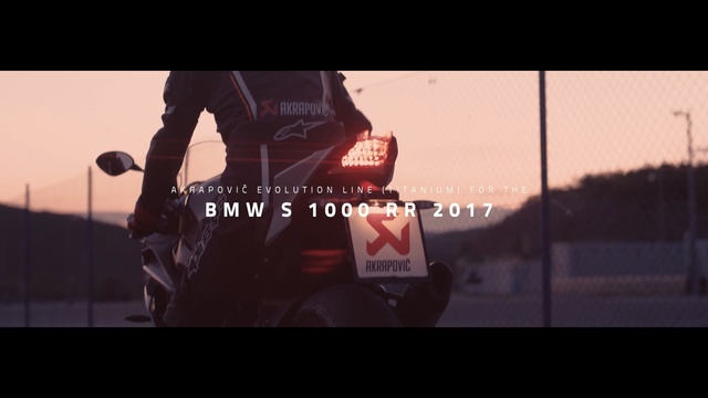 Video Reference: Font, Vehicle, Mode of transport, Automotive exterior, Screenshot, Photography, Personal protective equipment, Motorcycle, Brand, Car