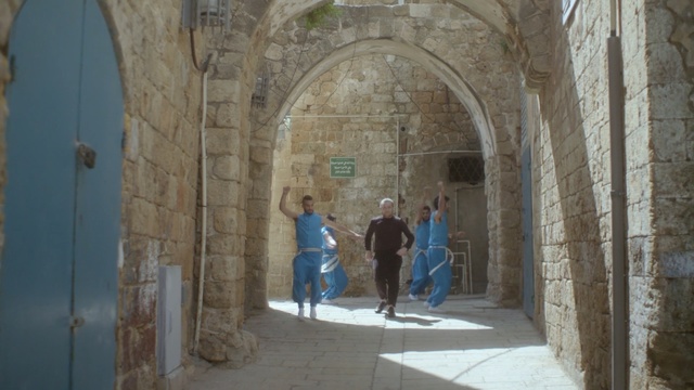 Video Reference: Arch, Building, Architecture, Arcade, Caravanserai, Historic site, Person