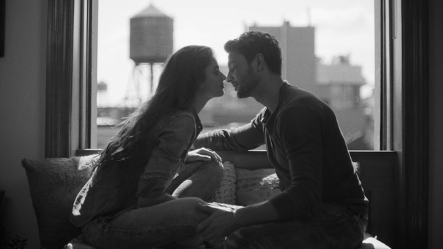 Video Reference: Photograph, Romance, Black-and-white, Monochrome, Interaction, Love, Snapshot, Kiss, Photography, Sitting, Person, Window, Man, Indoor, Looking, Front, Young, Holding, Using, Black, Living, Room, Computer, White, Woman, Laptop, Phone, Bed, Bus, Black and white, Clothing, Human face, Smile