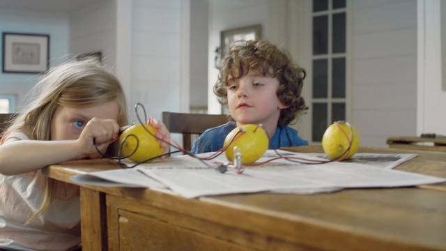 Video Reference: yellow, room, child, table, toddler, food, girl, Person