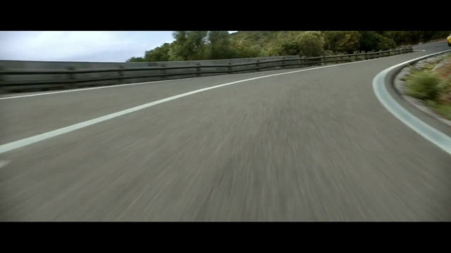 Video Reference: road, car, asphalt, lane, highway, ecosystem, infrastructure, mode of transport, race track, sky