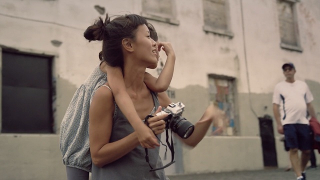 Video Reference: shoulder, girl, recreation, joint, road, street, Person