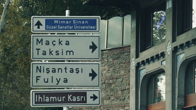 Video Reference: Street sign, Signage, Sign, Traffic sign, Font, Architecture