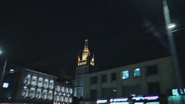 Video Reference: scoreboard, night, signboard, city, architecture, tower, building, skyscraper, board, urban