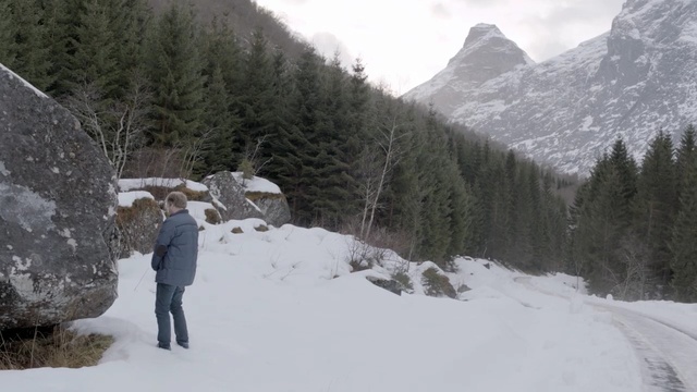Video Reference: snow, winter, geological phenomenon, wilderness, mountain, tree, mountain range, freezing, terrain, glacial landform, Person