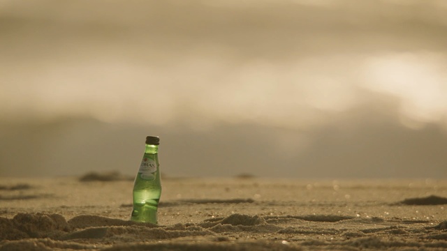Video Reference: Bottle, Water, Green, Sky, Drink, Sea, Cloud, Shore, Wave, Ocean, Person