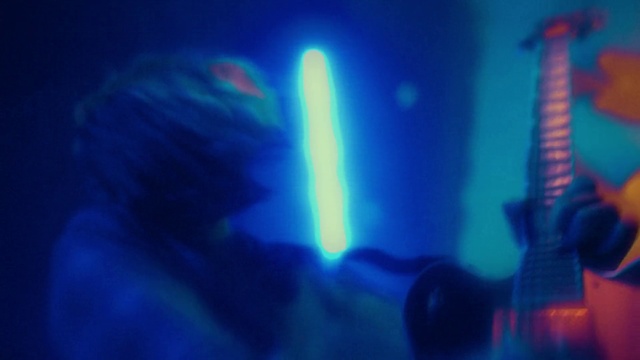 Video Reference: Blue, Automotive lighting, Gas, Entertainment, Lens flare, Electric blue, Magenta, Font, Event, Performing arts