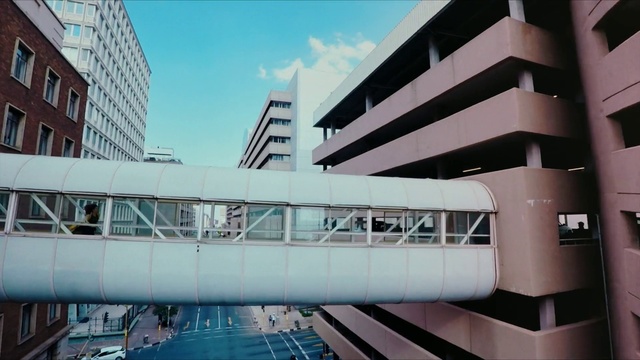 Video Reference: Sky, Building, Daytime, Cloud, Window, Architecture, Urban design, Tower block, Condominium, Commercial building