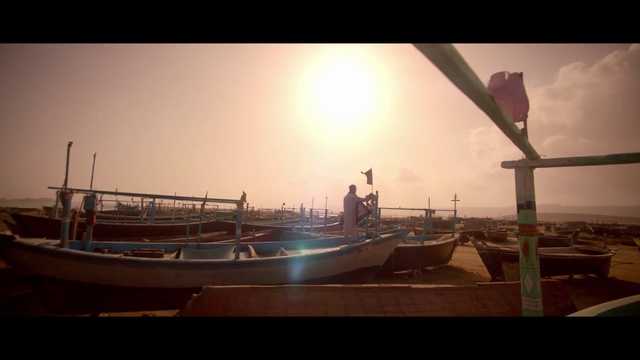 Video Reference: Sky, Atmospheric phenomenon, Morning, Water, Boat, Cloud, Sea, Photography, Vehicle, Waterway, Table, Small, Sitting, Large, Docked, Light, Lit, Dock, Several, White, Room, Parked, Standing, Ship, Watercraft, Lake