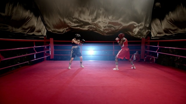 Video Reference: red, boxing ring, sport venue, boxing equipment, boxing, light, darkness, structure, pradal serey, night