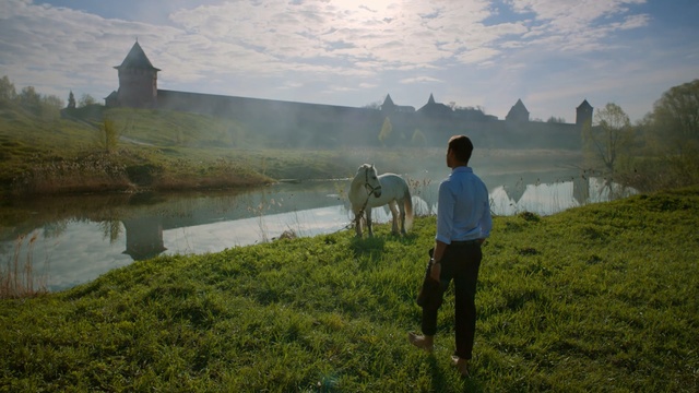 Video Reference: nature, mountainous landforms, sky, water, reflection, wilderness, mountain, tree, morning, grass, Person