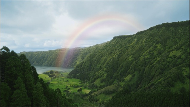 Video Reference: rainbow, nature, highland, vegetation, nature reserve, hill station, mount scenery, sky, water resources, waterfall