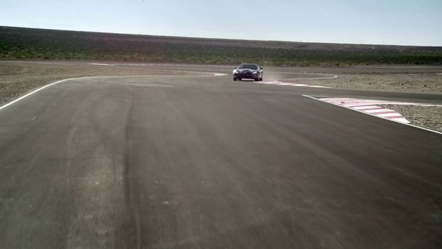 Video Reference: Race track, Asphalt, Vehicle, Performance car, Car, Road, Road surface, Ecoregion, Plain, Line