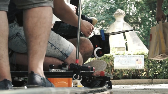 Video Reference: footwear, vehicle, car, leg, muscle, asphalt, recreation, tree, shoe, Person