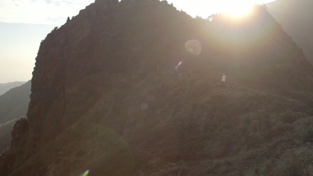 Video Reference: ridge, sky, mountain, mountain range, geological phenomenon, terrain, hill station, morning, sunlight, cliff