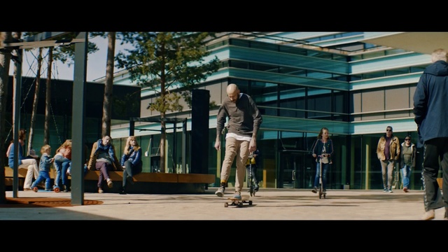 Video Reference: Photograph, People, Urban area, Snapshot, Standing, Public space, Human settlement, Metropolitan area, Street, Crowd