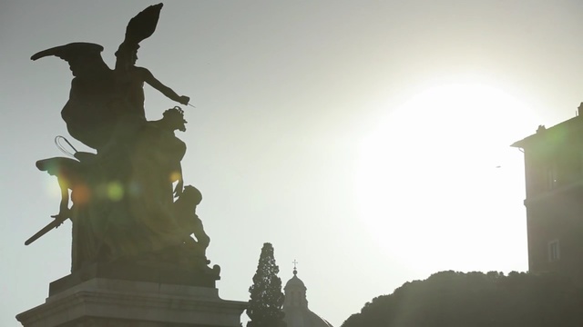 Video Reference: Sky, Statue, Landmark, Atmospheric phenomenon, Backlighting, Monument, Cloud, Atmosphere, Sunlight, Architecture, Person