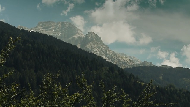 Video Reference: Mountainous landforms, Mountain, Highland, Hill station, Nature, Mountain range, Wilderness, Vegetation, Ridge, Sky, Person