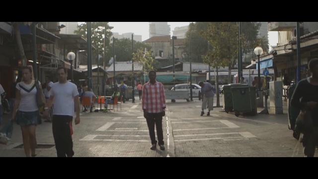 Video Reference: Photograph, People, Town, Mode of transport, Pedestrian, Urban area, Street, Neighbourhood, Public space, Snapshot, Person