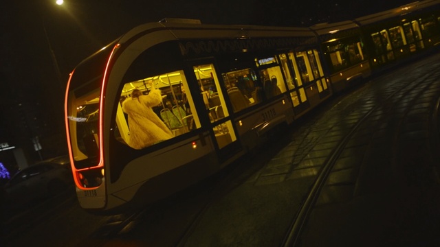 Video Reference: yellow, night, reflection, public transport, light, darkness, lighting, rapid transit, evening, midnight