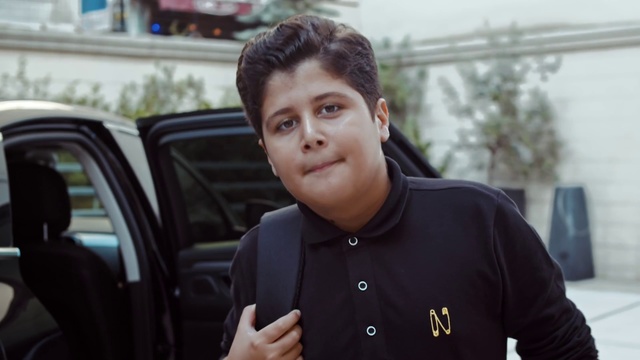 Video Reference: Face, Forehead, Luxury vehicle, Photography, Smile, White-collar worker, Vehicle, Black hair, Family car, Car