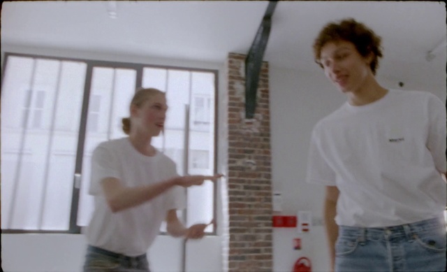 Video Reference: Shoulder, Standing, Arm, Wall, Ceiling, Plaster, Room, Plasterer, Person, Man, Indoor, Holding, Young, Front, Looking, Kitchen, Video, Playing, Living, Hand, People, Shirt, Board, Game, Wii, Remote, Table, White, Group, Clothing, Human face, Boy, Smile, Dance