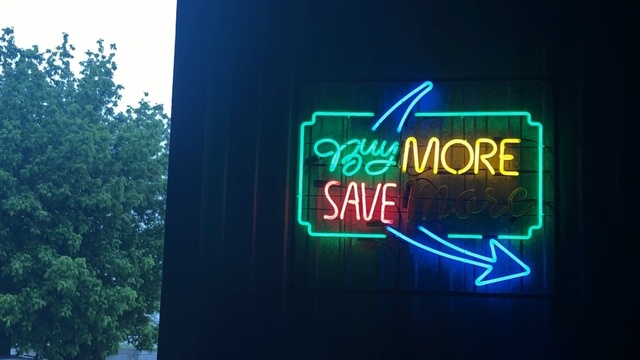 Video Reference: Neon, Neon sign, Light, Electronic signage, Signage, Font, Technology, Sky, Sign, Display device, Outdoor, Thing, Green, Sitting, Street, Clock, Hanging, Traffic, Red, City, Text, Tree