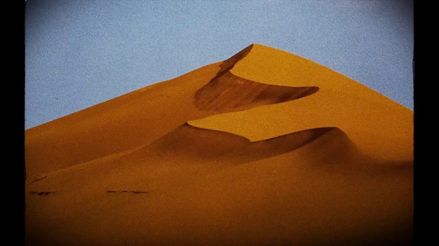 Video Reference: Brown, Ecoregion, Sky, Slope, Erg, Natural landscape, Landscape, Tints and shades, Singing sand, Horizon