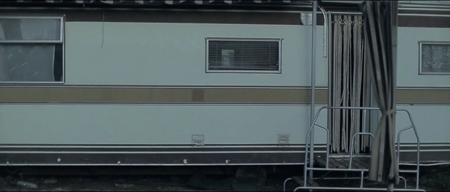 Video Reference: rolling stock, architecture, residential area, wall, house, facade, home, passenger car, siding, railroad car
