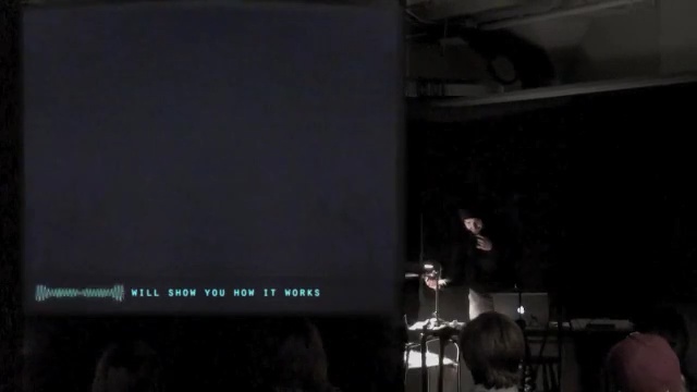 Video Reference: stage, mode of transport, darkness, entertainment, display device, technology, performance, rock concert, lecture, sound