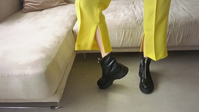 Video Reference: Yellow, Footwear, Leg, Human leg, Shoe, Floor, Room, Furniture, Flooring, Table