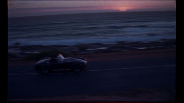 Video Reference: Sky, Vehicle, Sea, Car, Automotive design, Calm, Ocean, Race car, Cloud, Beach