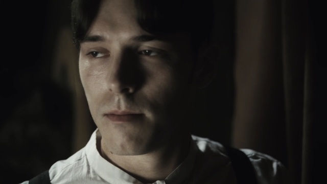 Video Reference: Face, Black, Facial expression, Nose, Head, Cheek, Chin, Eyebrow, Darkness, Eye, Person