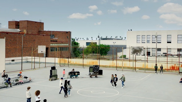 Video Reference: Architecture, Building, Sport venue, City, Team sport, Urban design, Skating, Ice rink, Person