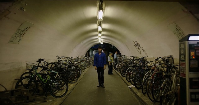 Video Reference: infrastructure, tourist attraction, tree, tunnel, bicycle, darkness, Person