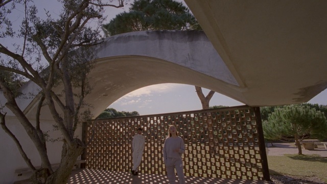 Video Reference: property, architecture, shade, roof, outdoor structure, pavilion, tree, facade