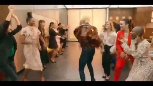 Video Reference: Choreography, Dance, Event, Performing arts, Dancer, Performance, Line dance, Performance art, Fun, Country-western dance, Person, Indoor, Group, Standing, Man, Young, Dressed, People, Wedding, Woman, Holding, Table, Walking, Room, Cake, Playing, Train, Riding, White, Clothing, Footwear, Floor, Dancing, Dress, Text