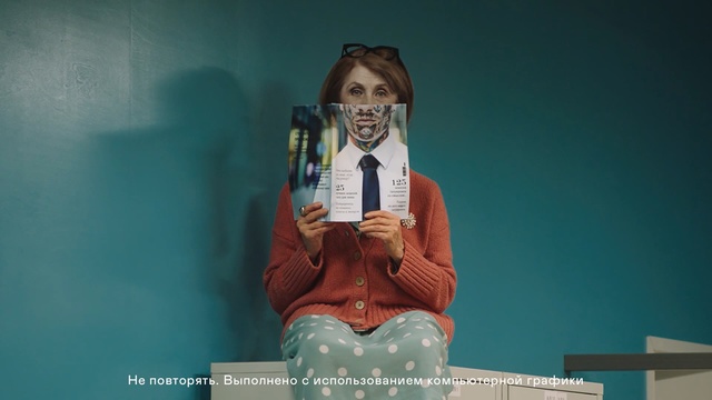 Video Reference: Temple, Smile, Happy, Sitting, World, Looking, Woman, Wearing, Green, Phone, Holding, Table, Large, Mirror, Water, Blue, Man, Clock, Human face, Text, Clothing, Person, Cartoon