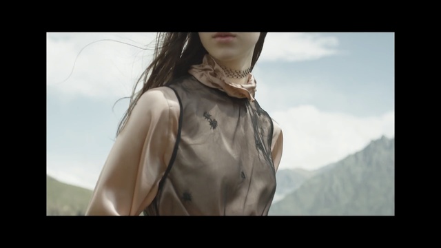 Video Reference: human hair color, neck, girl, outerwear, mouth, long hair, arm, top, muscle, brown hair