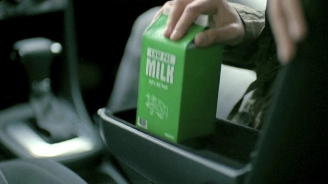 Video Reference: green, product, bottle, vehicle, product, car, drink, Person