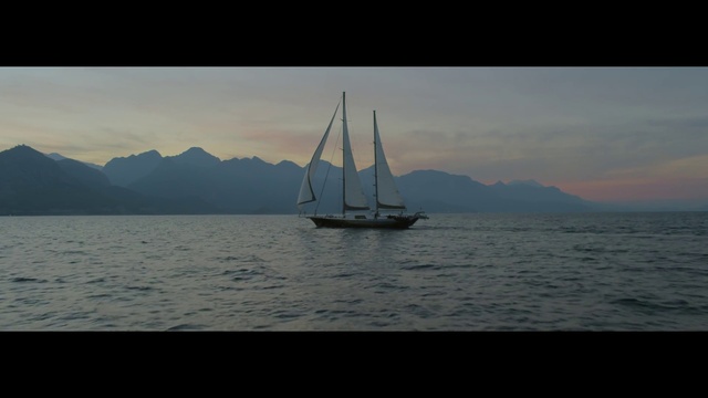 Video Reference: Sky, Sailing, Boat, Vehicle, Sail, Calm, Sailboat, Watercraft, Atmospheric phenomenon, Sea