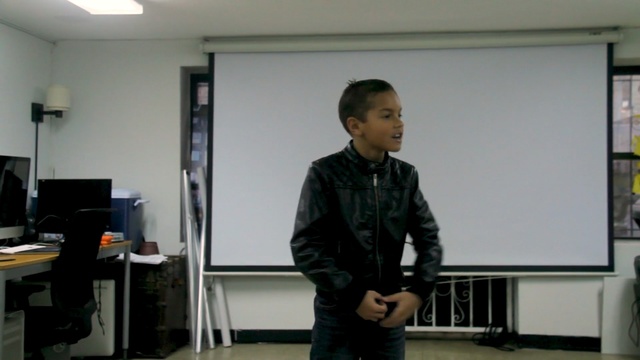 Video Reference: standing, technology, electronic device, lecture, Person