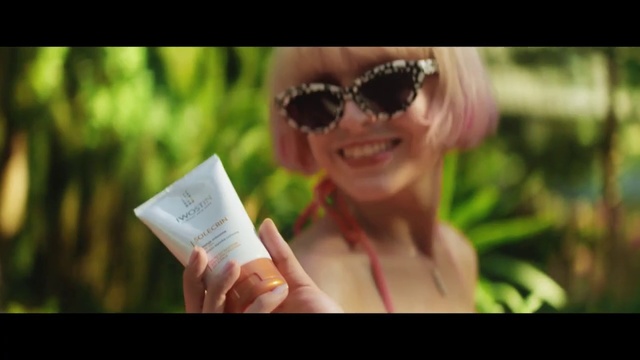 Video Reference: Eyewear, Sunglasses, Hair, Photograph, Glasses, Facial expression, Skin, Lady, Smile, Beauty, Person, Holding, Food, Woman, Hand, Small, Red, Fruit, White, Remote, Glass, Text, Human face, Book, Spectacles