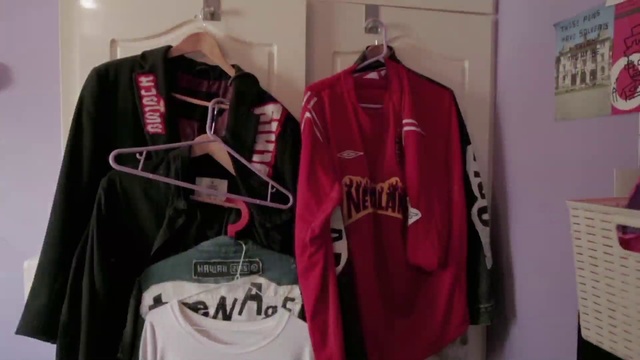 Video Reference: Clothing, Clothes hanger, Sportswear, Jersey, Jacket, Pink, Sleeve, Outerwear, Room, Textile