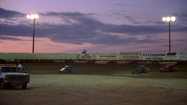Video Reference: Sky, Dirt track racing, Vehicle, Evening, Cloud, Street light, Road, Car, Dusk, Racing